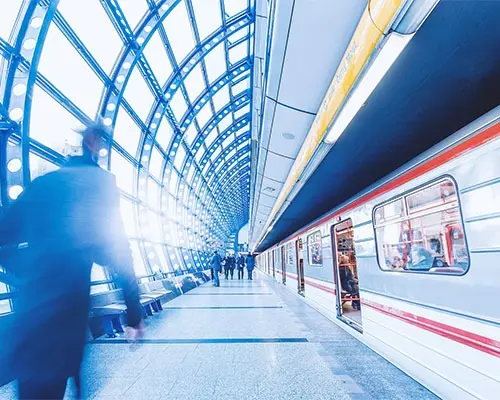 Commuters walking through a modern train station
